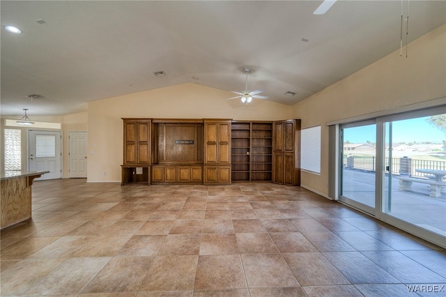 unfurnished living room featuring vaulted ceiling, visible vents, a ceiling fan, and baseboards