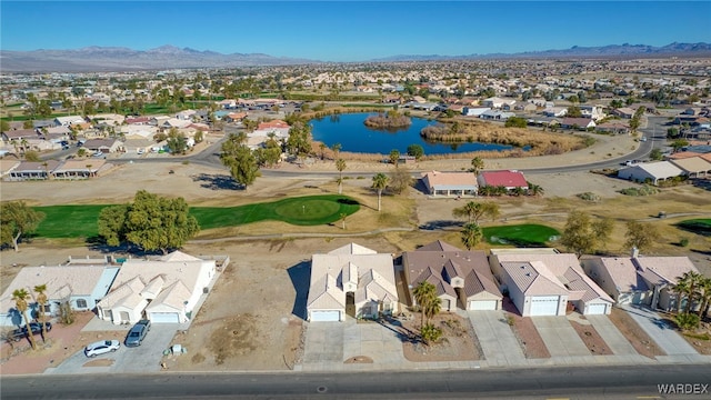 aerial view with a water and mountain view and a residential view