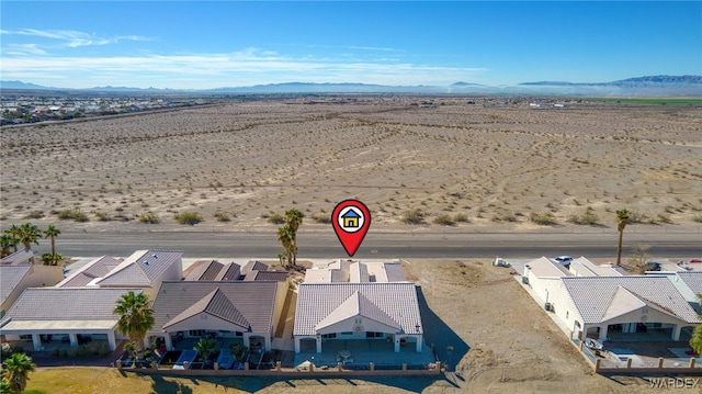 bird's eye view with a mountain view and a desert view