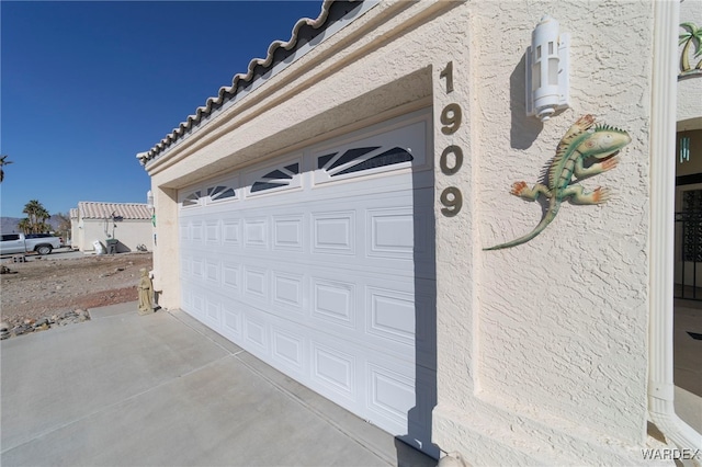 garage featuring driveway