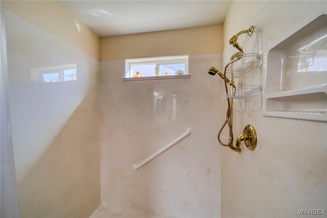 full bath with a marble finish shower