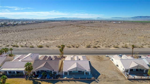 aerial view featuring view of desert and a mountain view