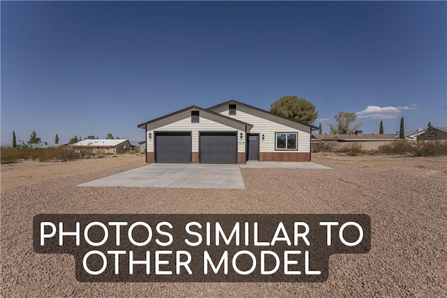 7674 E Oxbow Dr, Kingman, AZ 86401 - view of front of house featuring concrete driveway