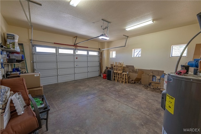 garage with a garage door opener and electric water heater