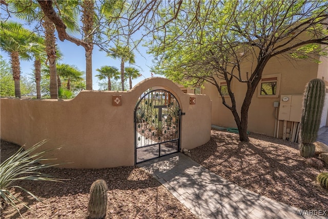 view of gate featuring fence