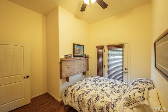 bedroom with ceiling fan, baseboards, and dark wood finished floors