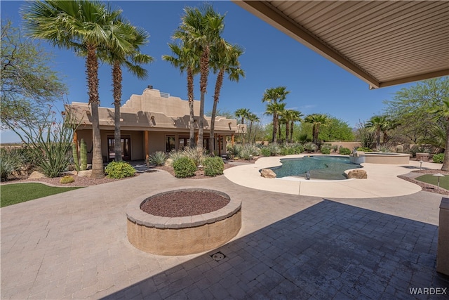 outdoor pool with a patio area