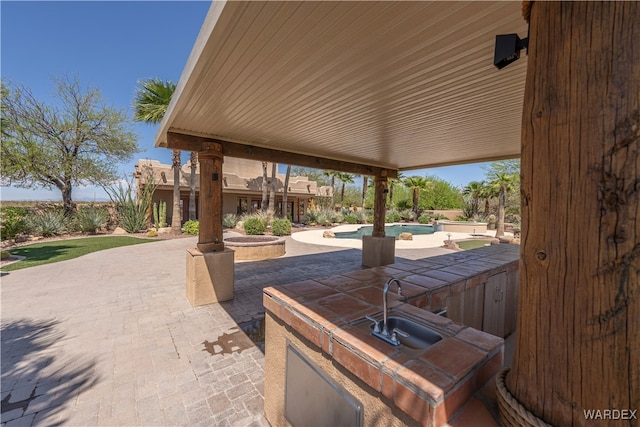 view of patio / terrace with an outdoor pool