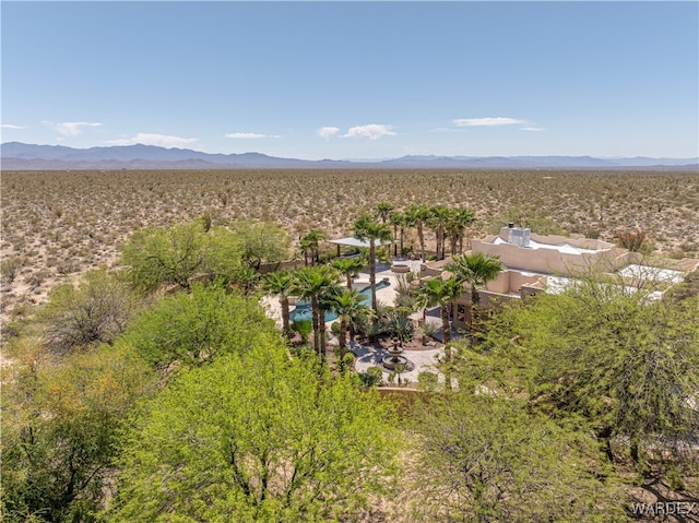 birds eye view of property featuring a mountain view