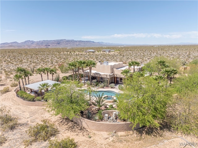 birds eye view of property featuring a mountain view