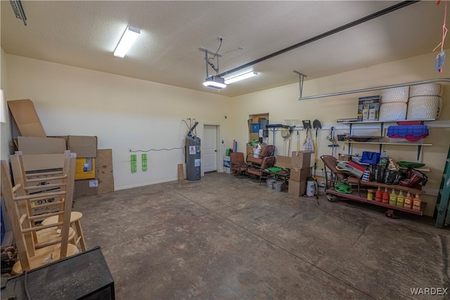 garage featuring water heater and a garage door opener