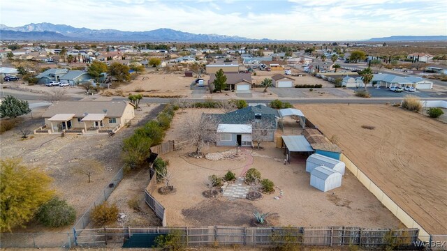 drone / aerial view with a residential view and a mountain view