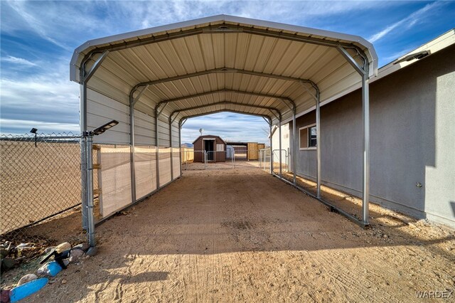 view of parking featuring a carport and fence