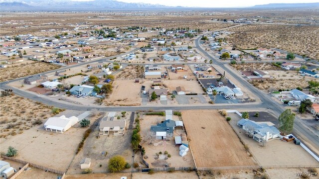 drone / aerial view featuring a residential view and a mountain view