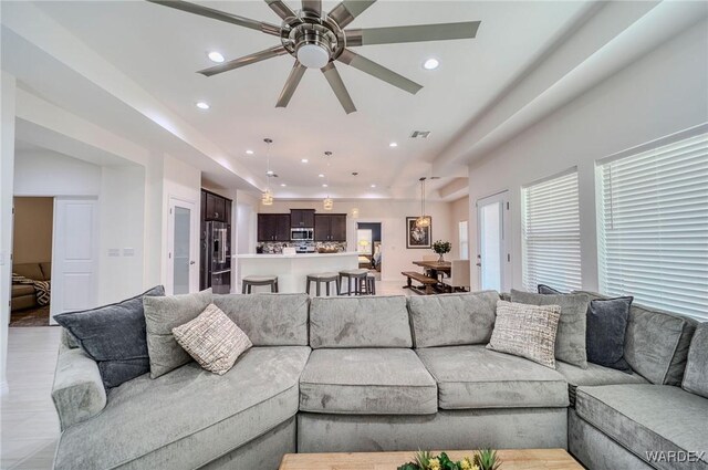 living room featuring recessed lighting, visible vents, and ceiling fan