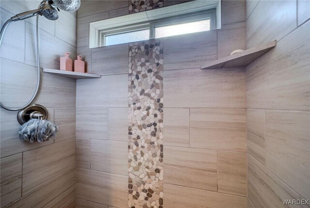 full bathroom with tiled shower