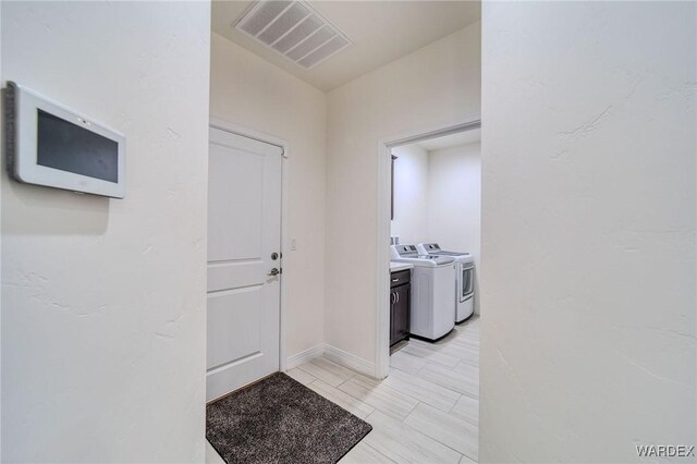 interior space featuring visible vents and separate washer and dryer