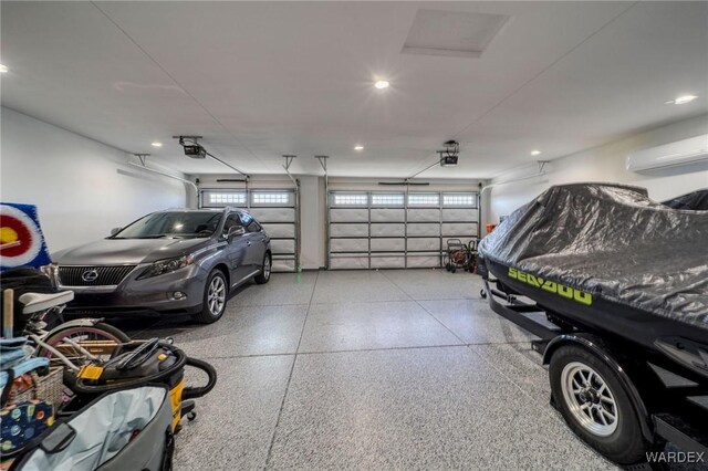 garage with a wall mounted AC, recessed lighting, and a garage door opener