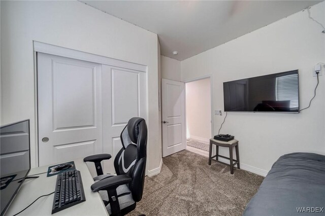 office featuring dark carpet and baseboards