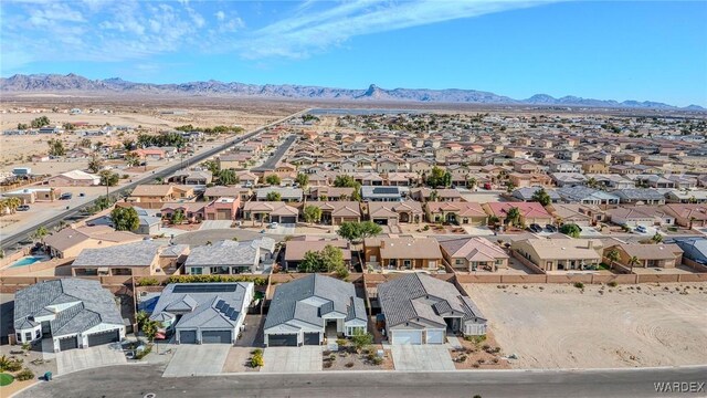 drone / aerial view featuring a residential view and a mountain view