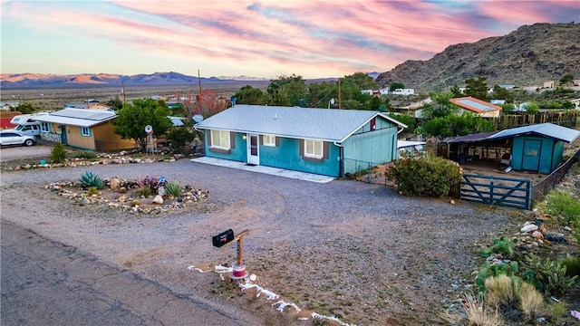 3345 W Smith Dr, Golden Valley, AZ 86413 - view of front facade with a mountain view, driveway, and fence