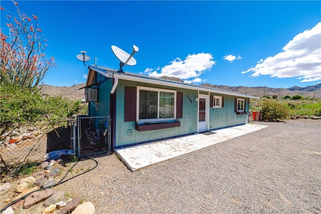 3345 W Smith Dr, Golden Valley, AZ 86413 - single story home with a mountain view, a gate, a patio area, and fence