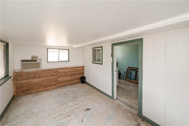 3345 W Smith Dr, Golden Valley, AZ 86413 - spare room featuring a wall mounted air conditioner and baseboards