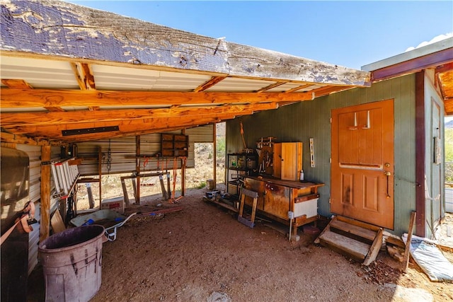 3345 W Smith Dr, Golden Valley, AZ 86413 - view of patio with entry steps, an exterior structure, and an outbuilding