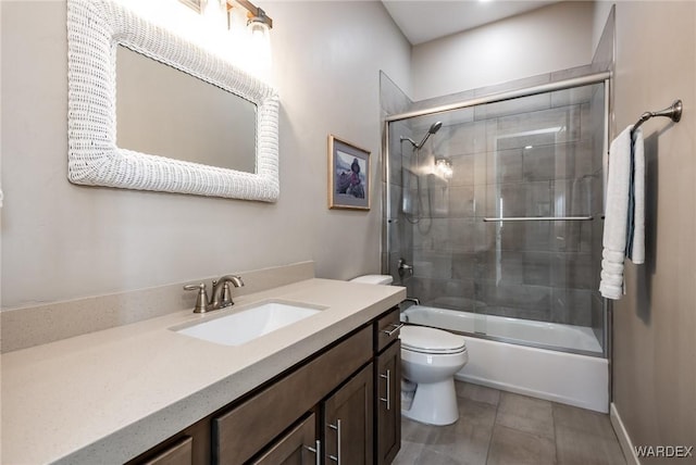 full bathroom with vanity, toilet, and shower / bath combination with glass door