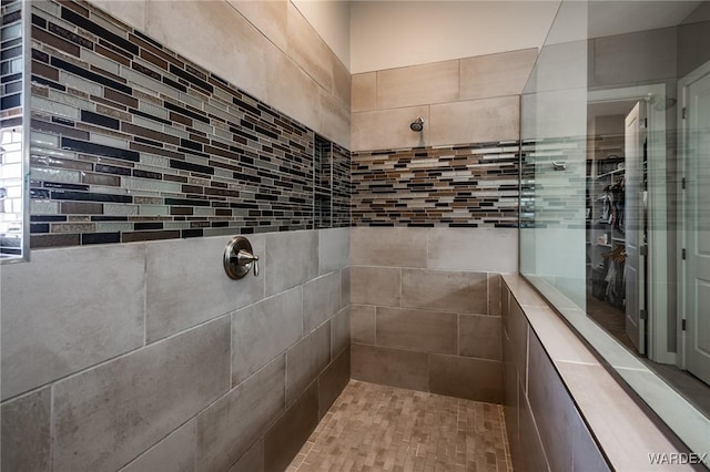 full bath featuring tiled shower