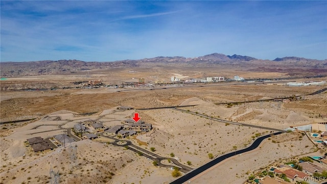 birds eye view of property with a rural view, a mountain view, and view of desert