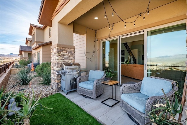 view of patio / terrace featuring fence and grilling area