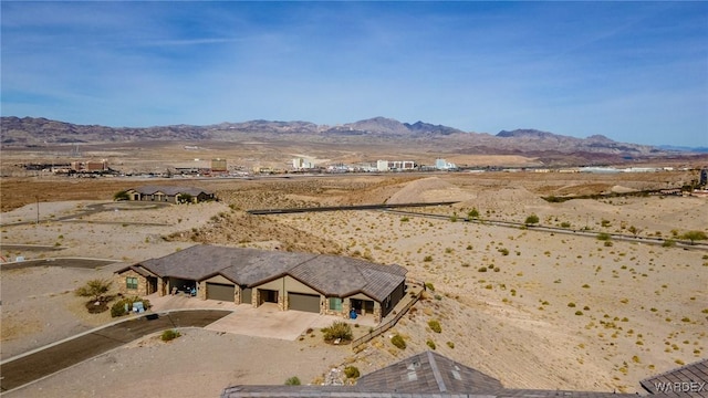 aerial view featuring a desert view, a mountain view, and a rural view