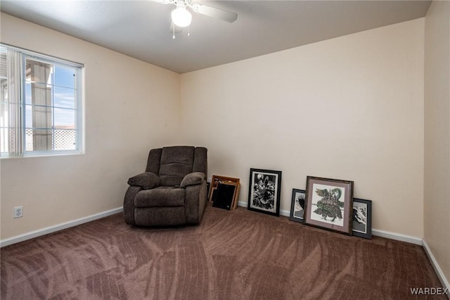 sitting room with carpet and baseboards