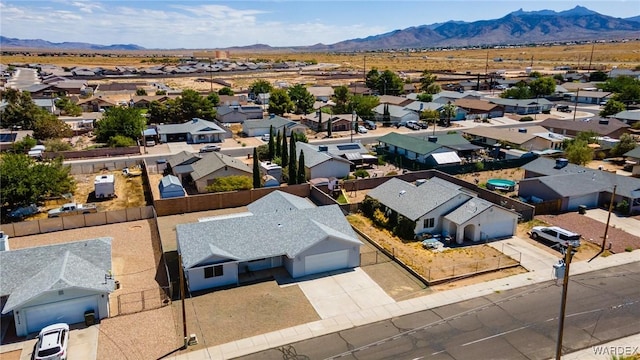 birds eye view of property with a residential view and a mountain view