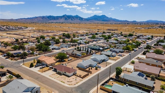 drone / aerial view featuring a residential view and a mountain view