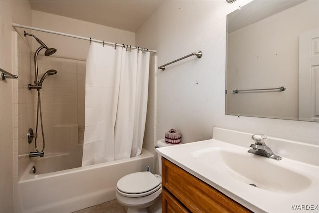 bathroom with vanity, shower / bath combo with shower curtain, and toilet