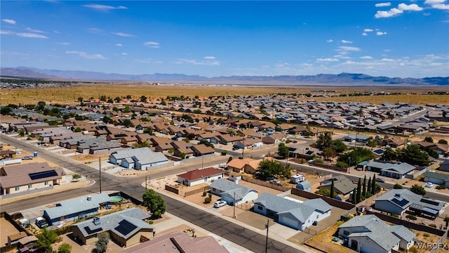 drone / aerial view featuring a residential view and a mountain view