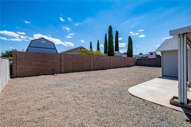 view of yard featuring a fenced backyard and a patio