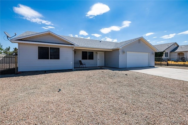 single story home featuring driveway, a garage, and fence