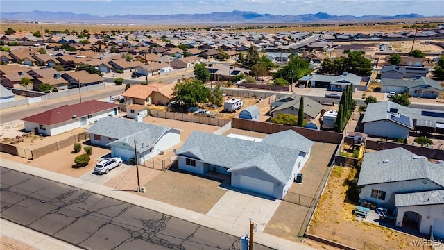 birds eye view of property with a residential view and a mountain view