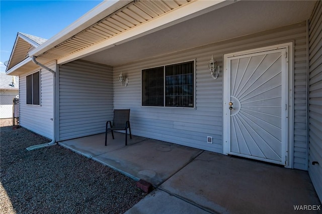 doorway to property featuring a patio area