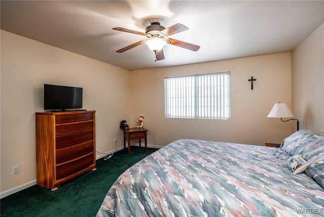 bedroom featuring baseboards, dark carpet, and a ceiling fan