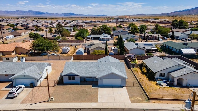 bird's eye view featuring a mountain view and a residential view