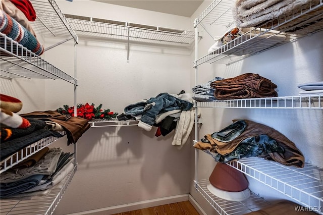 spacious closet with wood finished floors