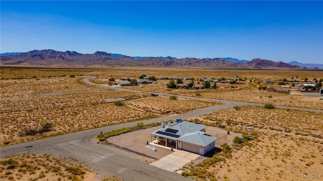 bird's eye view with view of desert and a mountain view