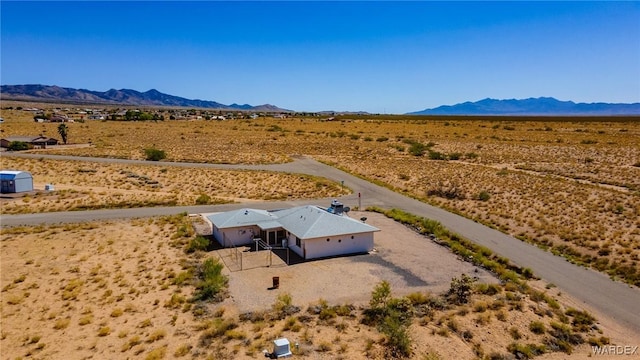 bird's eye view featuring a desert view and a mountain view