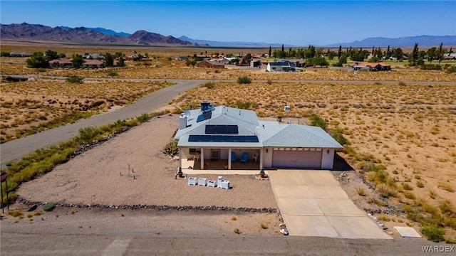 drone / aerial view featuring a mountain view