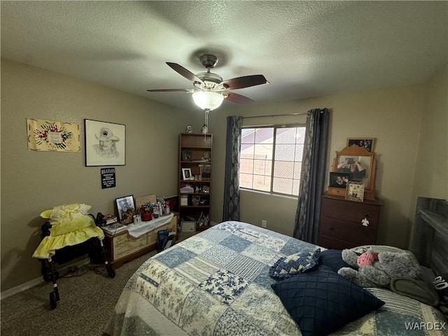 carpeted bedroom featuring ceiling fan and a textured ceiling