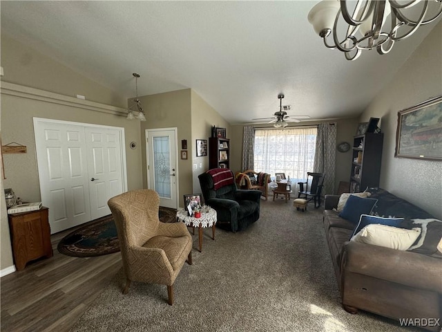 living area featuring ceiling fan with notable chandelier, wood finished floors, and lofted ceiling